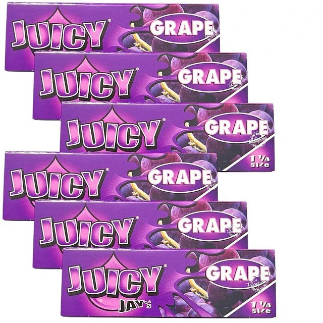 Papelillos sabor uva Juicy Jay's 1 1/4, pack de varios, fondo violeta con imágenes de uvas.